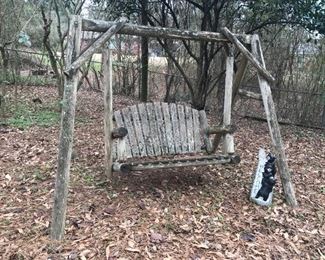 Rustic yard swing. We have not tried to move it, but have been told it is quite heavy.