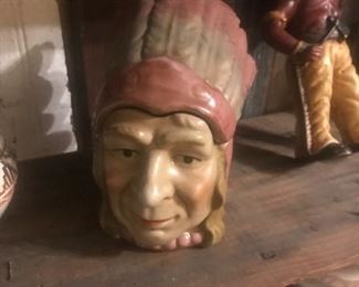 This American Indian chief was made to be used for storing tobacco, and is a vintage piece.