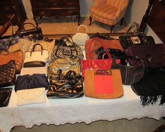 Designer purses including several Coach