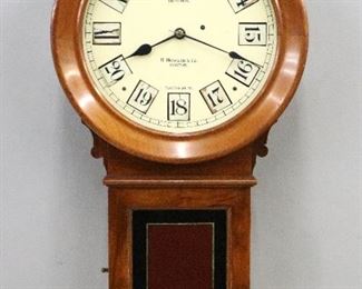 A Rare 19th century E. Howard "Kosmic" model wall clock.  8-day weight driven time only movement with a unique painted iron dial with both Roman and Arabic numerals on blocks which rotate as each hour passes enabling a 24-hour reading for Railroad usage.  Time is indicated with Roman numerals I-XII and Arabic numerals 13-24.  Dial signed "E. Howard & Co., Boston, Pat'd June 9th, '85".  Walnut case with circular molded dial door and rectangular lower door with reverse painted and gilded glass panel, shaped short drop, stamped "19".  Paper instruction label inside bottom is 80% intact.  Older finish with minor wear, replaced Howard dial with cutouts for numerals, running and functioning correctly when cataloged.  This clock is basically a Howard Model 70 with the upgraded dial function.  31" high.  ESTIMATE $15,000-25,000

