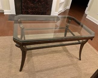 #8 glass top coffee table with heavy metal base 48x31x24 $150.00