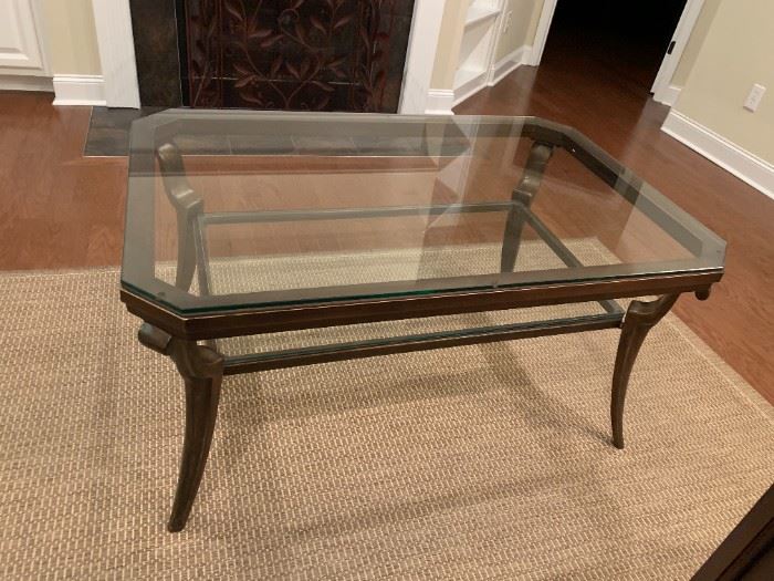 #8	glass top coffee table with heavy metal base 48x31x24	 $150.00 

