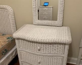 #24 wicker dresser with detached mirror and 3 well sliding wood doors 32x19x32 mirror 20x29 $125.00