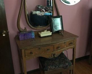 Love this little oak vanity with swing mirror. Great vintage mirror in background.