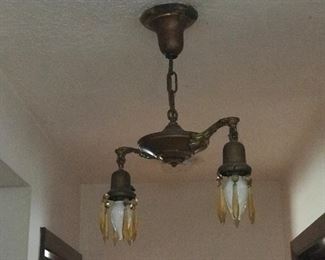 3 Amber Prism and brass overhead lights. Electrician has to remove lights if purchased.