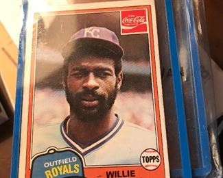 Willie Wilson baseball card and stack of card protectors
