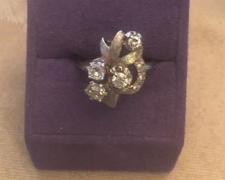 real deal here-diamonds and white gold 14k i believe- 4  main stones all slightly different sizes  estate piece approx size 8.5-8.75 $599