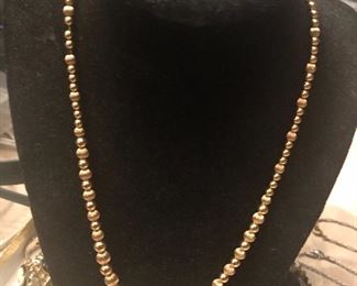 all gold  beads necklace  weighs more than you would think   5 plus grams 