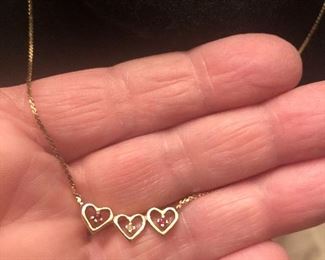 14k yellow gold  3 heart necklace  2 small ruby and 1 small diamond  $129
