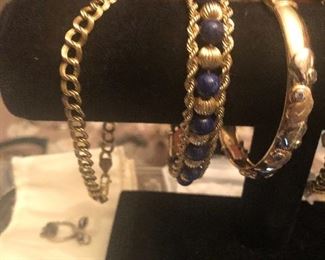 all gold  some w/ gemstones  serious weight on some call me  for details   SOLD LAPIS AND GOLD ROPE BRACELET   SOLD HEART /DIAMOND BANGLE HAVE PLAIN GOLD 