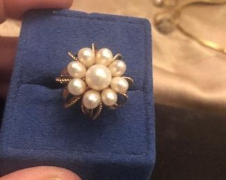 Pearl cluster ring in yellow gold. Stamp is worn a bit could be 10 or 14. Tiny size. Just about a 5  or slightly under  i will have it tested so we can all know for sure 