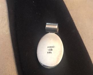 back of coral color pendant 