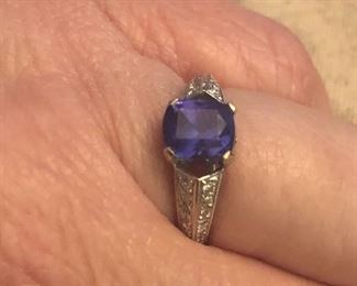 18 k white gold  tanzanite  and diamonds  great ring !! approx size 6-6.25  the stones are really nice on this estate piece $350