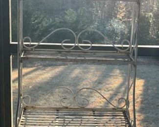 BAKERS RACK THAT HAS BEEN USED OUTDOORS
