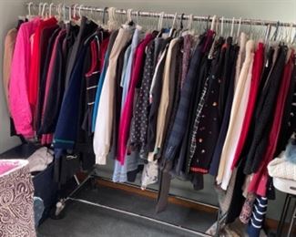 LARGE MASTER BEDROOM FILLED WITH LADIES CLOTHING AND ACCESSORIES. LOTS OF RALPH LAUREN AND VERA BRADLEY