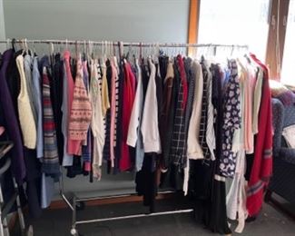 RACK OF DRESSES, SKIRTS AND JACKETS
