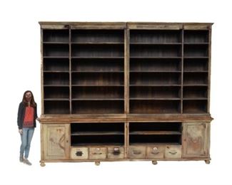 Monumental wooden general store display cabinet, many open shelves atop two doors, flanking six drawers with four open shelves, separates into four parts, metal hardware with carved accents, includes two keys.
114 x 140.5 x 17"