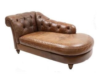 Vintage brown leather chaise lounge, button back, rising on wooden legs.
36 x 72 x 39"