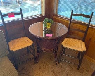 Rattan round table and 2 rush seat chairs