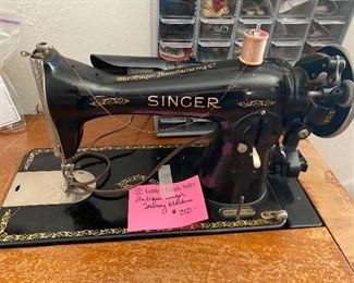 Antique Singer sewing machine in cabinet