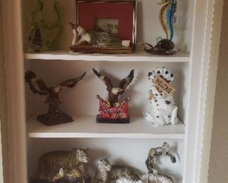 various figurines - eagles, lions, dog, sea lion