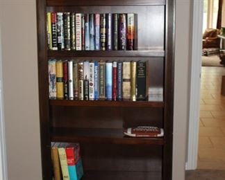 Solid Wood bookshelf, many fiction books, most hardcovers