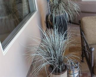 Outdoor artificial plants with planters