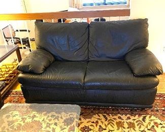 Natuzzi leather two-seater couch
Dimensions: 57”L x 32.5”W x 16.5H (seat)
Price: $450