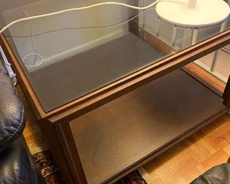 Smoked glass and burnished wood two-tier end table
Dimensions: 31” x 31”
Price: $275
