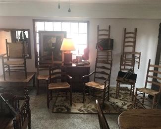 Collection of handmade antique shaker ladder back chairs.