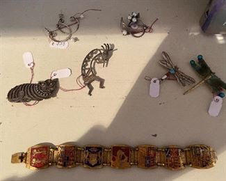 All Sterling with exception of large dragon fly and bracelet. Small Sterling Pins $18; Sterling w/Pearl Earrings $25; Sterling dragon fly with natural stone beads $28; dragon fly green & blue $25; Vintage Heraldic England Royal Crest Bracelet $18