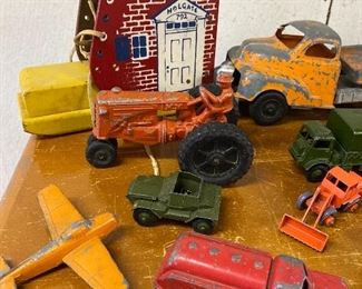 ^^Playskool lace up boot $15; big tractor $12; yellow plane $10; Green open truck $12; army green truck on right $25; front green truck $4; red truck $9; little orange tractor $9^^