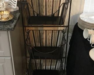 Metal baskets on stand