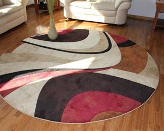 Large round rug in outstanding condition. 