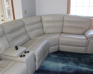 Purchased new 2018. Five pc set unhooks and moves easily.  Top grain leather in wear areas.  Bonded leather on backs, etc.  