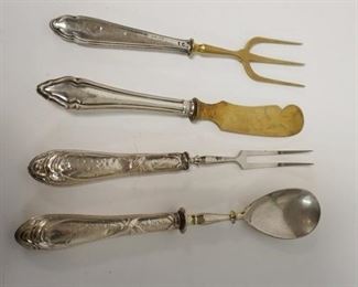 1072	GROUP OF FOUR 800 SILVER HANDLED UTENSILS, SOME DENTING ON HANDLES
