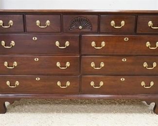 1075	STATTON SOLID CHERRY OLD TOWNE 11 DRAWER CHEST W/SHELL CARVED CENTER DRAWER ON BRACKET FEET, 60 IN WIDE X 19 1/4 IN DEEP X 34 1/4 IN HIGH
