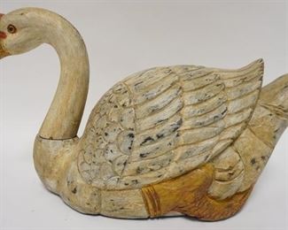 1103	WOODEN CARVED & PAINT DECORATED GOOSE. 16 IN L 9 1/2 IN H 
