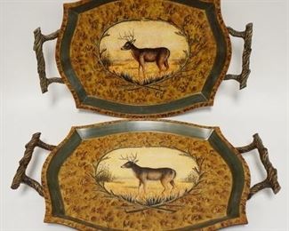 1109	TWO SERVING TRAYS W/ RUSTED TWIG STYLE HANDLES & STAG IMAGES IN CENTER. 23 IN W 15 1/2 IN H
