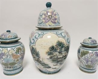 1120	THREE THIA DECORATED POTTERY COVERED URNS. TALLEST IS 18 IN 
