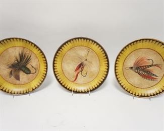 1126	THREE 12 1/4 IN POTTERY PLATES W/ FLY FISHING LURE DECORATION. TWO OF THE PLATES HAVE SMALL RIM CHIPS 
