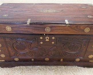 1200	CARVED ROSEWOOD ASIAN STORAGE CHEST W/BRASS MOUNTS & INLAY, INTERIOR HAS TRAYS, CHEST IS IN NEED OF RESTORATION, 36 IN X 16 3/4 IN X 19 IN

