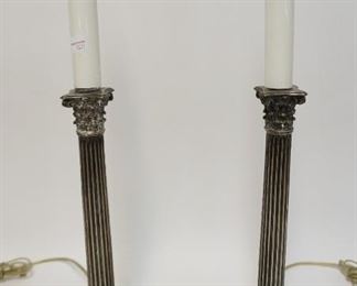 1215	PAIR OF SILVER PLATE TABLE LAMPS IN THE FORM OF CANDLE HOLDERS, 19 IN HIGH
