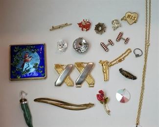 1279	JEWELRY LOT INCLUDING ENAMELLED COMPACT, 7 PINS, STAINLESS STEEL CUFF LINKS, 3 CRYSTAL PIECES, GOLF CLUB AND HORN CHARMS, 2 BUCKLES, ETC., AS FOUND
