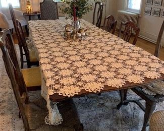 Sleek antique dining table with room for 10
