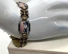 Askel Holmsen/Norne Sterling Silver Guilloche Enamel Scenic Bracelet. Lovely bracelet made of 5 scene segments depicting Nordic outdoor life, and 5 black flower segments. Scenes depict a polar bear, moose, viking ship, sleigh, and sunset at sea. It has an art deco feel. Piece is in excellent condition with all enamel intact and smooth. Clasp fastens easily, safety chain in place. The guard hook is slightly bent - could be adjusted by a jeweler. The main clasp is fine. "925S" Dimensions: approximately 6-6/8" around. Wt. 18.2 gm.