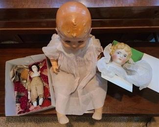 Middle is 1940's composition doll, clothing in okay condition, this is a group photo of all together