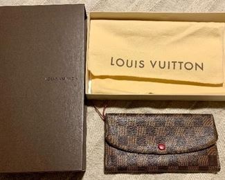 Louis Vuitton
Damier Ebene Emilie Wallet Red, Comes With: dust bag, box. Measurements
Length: 7.5 in $450
Width: 0.75 
