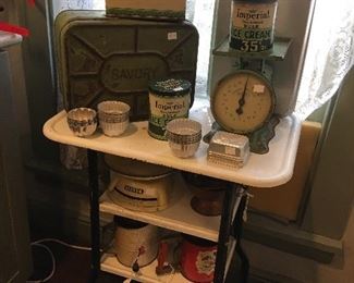 Antique Typewriter table, Assorted Antique Kitchen Items. Antique tins, ice cream, bread, crackers