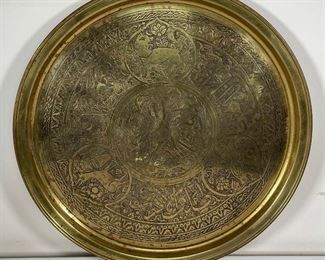 Lot 93 | LARGE BRASS JUDAICA PLATTER | With Hebrew inscriptions and depictions of animals in reserves, marked on the back "SKANDAR MATAR & SONS / NAZARETH"